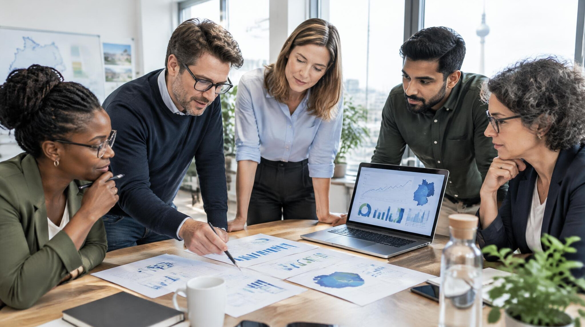 Research team reviewing data charts in a modern office